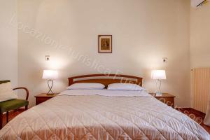 A bed or beds in a room at Locazione turistica Lorusso