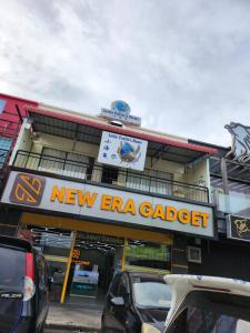 a new era gaza garage with cars parked in front of it at LTH (Little Turtle's Home) in Semporna