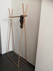a wooden stand with a potted plant on a wall at Swiss House Apartments in Slavonice