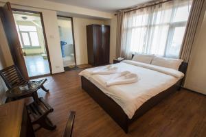 Ένα ή περισσότερα κρεβάτια σε δωμάτιο στο Hotel Yambu kathmandu
