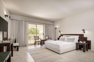 A bed or beds in a room at Sindbad Club