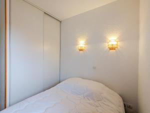 Posteľ alebo postele v izbe v ubytovaní Appartement 2/4 pers, Résidence 4* Les Hauts de Valmeinier, Centre station + 9 fotografií