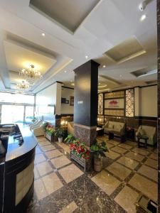 a lobby of a hotel with couches and a fireplace at Al Deyafah Narjis-الضيافة نرجس in Khamis Mushayt