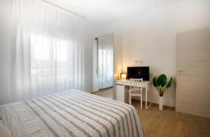 A bed or beds in a room at Appartamento Carducci Fiera Rho Milan