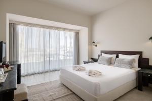 A bed or beds in a room at Sindbad Club