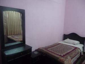 Letto o letti in una camera di Pashupati Darshan Hotel
