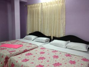 Letto o letti in una camera di Pashupati Darshan Hotel