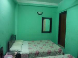 Letto o letti in una camera di Pashupati Darshan Hotel
