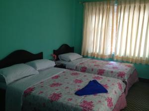 Letto o letti in una camera di Pashupati Darshan Hotel