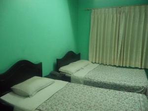 Letto o letti in una camera di Pashupati Darshan Hotel
