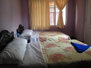 Letto o letti in una camera di Pashupati Darshan Hotel