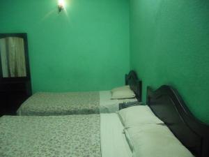 Letto o letti in una camera di Pashupati Darshan Hotel