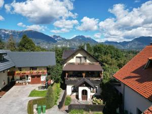 an aerial view of a house with mountains in the background at Bled Home in Bled