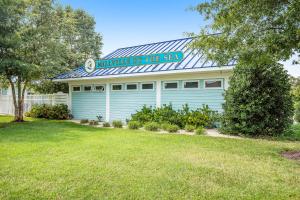 a building with a sign that reads hunter my her reen at Millville by the Sea --- 23772 Pembroke Lane in Millville