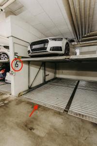 a car is sitting on a shelf in a garage at Stilvolle, gemütliche Wohnung mitten im ZENTRUM in Leipzig