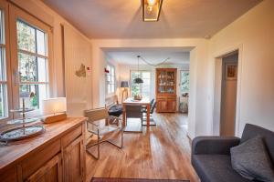 a living room with a couch and a table with a lamp at Ferienhaus Asten-Lodge in Winterberg