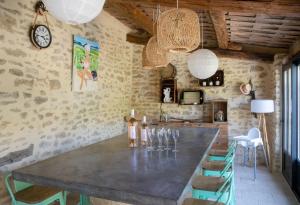 a dining room with a large table and chairs at Maison du bonheur 10pers Piscine Privee et Chauffee in Grignan