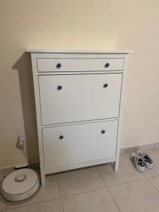 a white dresser with a toilet in a room at Paralimni in Paralimni