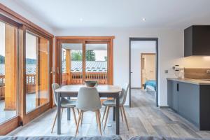 a kitchen and dining room with a table and chairs at Le Samance 1 in Le Grand-Bornand