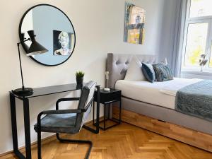 Posteľ alebo postele v izbe v ubytovaní BELLE ART Design Suite im Herzen von Wien