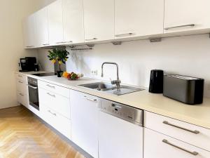 Kuchyňa alebo kuchynka v ubytovaní BELLE ART Design Suite im Herzen von Wien