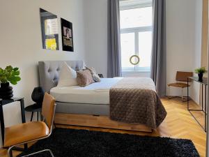 Posteľ alebo postele v izbe v ubytovaní BELLE ART Design Suite im Herzen von Wien