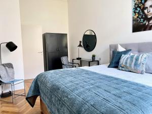 Posteľ alebo postele v izbe v ubytovaní BELLE ART Design Suite im Herzen von Wien