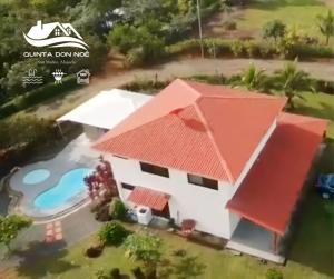an aerial view of a house with a swimming pool at Quinta Don Noé in San Mateo