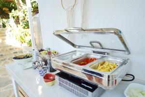 a tray of food sitting on a counter with food at Golden Lighthouse Hotel in Patara