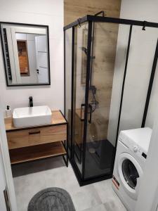 Fotografia z galérie ubytovania Uroczy apartament z miejscem na auto w garażu vo Varšave