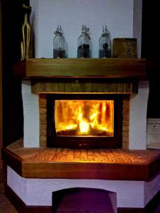 a fireplace with two bells on top of it at Gustav House in Daugavpils