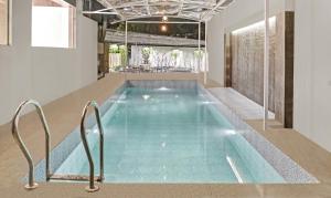 a swimming pool in a house at Treebo Tryst Widlor Boutique in Mumbai