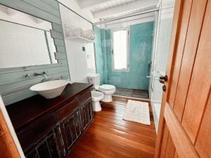 a bathroom with a sink and a toilet in it at Punta Ballena Punta del Este in Punta del Este