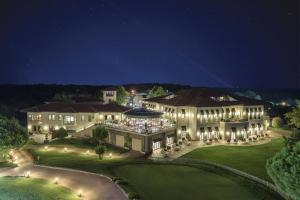 an aerial view of a mansion at night at Kemer Country Hotel İstanbul in Istanbul
