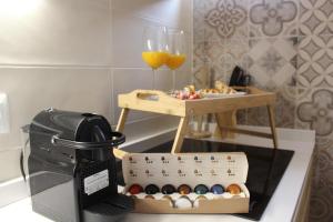 a table with a box of eggs and a glass of orange juice at Premium Apartment PLAZA MAYOR in Salamanca