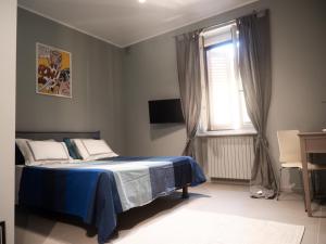 Giường trong phòng chung tại Casa Greta, Nuovo silenzioso bilocale nel cuore di Milano