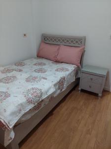A bed or beds in a room at El Rehab city Cozy apartment 3 bedrooms