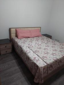 A bed or beds in a room at El Rehab city Cozy apartment 3 bedrooms