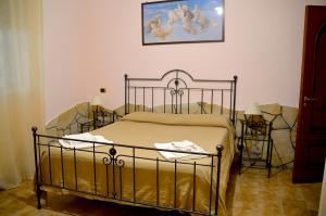 Postel nebo postele na pokoji v ubytování Angelo Delle Aci