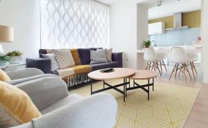 a living room with a couch and a table at Brisa Marina in A Guarda