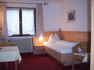 En eller flere senger på et rom på Hotel Bergerhof