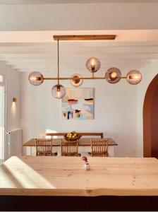 a dining room with a wooden table with chairs at House with garden ideal D-DAY beaches and Caen in Hermanville-sur-Mer