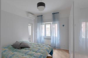 Кровать или кровати в номере Stupendo appartamento in quartiere residenziale