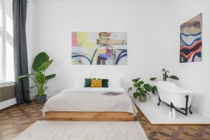 Łóżko lub łóżka w pokoju w obiekcie oompH Koszyki Luxurious Apartments