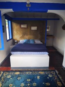 Ein Bett oder Betten in einem Zimmer der Unterkunft Hostal Parque Mayoral