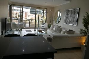 Ένα ή περισσότερα κρεβάτια σε δωμάτιο στο Little Venice Self Catering
