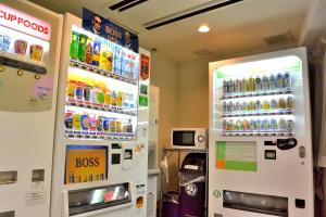 a refrigerator filled with lots of different types of drinks at Hotel Hokke Club Niigata Nagaoka in Nagaoka