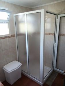 a bathroom with a shower and a toilet at Casa Dos Mosteiros in Mosteiros