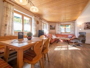 a living room with a table and a couch at Susanne in Bürserberg