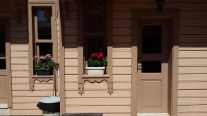 two potted plants on the windows of a house at Valide i Suit in Istanbul